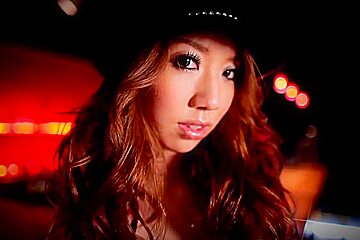 Japanese Gal Tied Up With Her Hands At The Bar