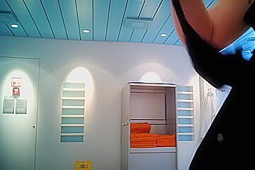 Mature Fem Changes In Changing Room Showing Back And Tits