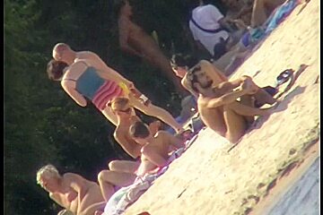 Sexy Chick Tanning Naked On The Beach And Caught On Cam