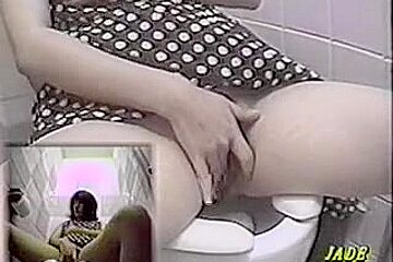 A Naughty Asian Masturbates In Toilet Cabin