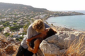 Beautiful Teen (18)+ Couple In Love Passionately Kissing Above The Sea On Crete Island