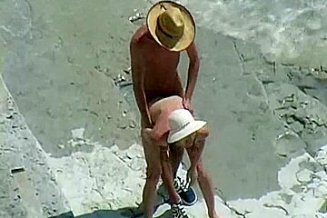 Bare Beachgoers Caught Fucking On Cam